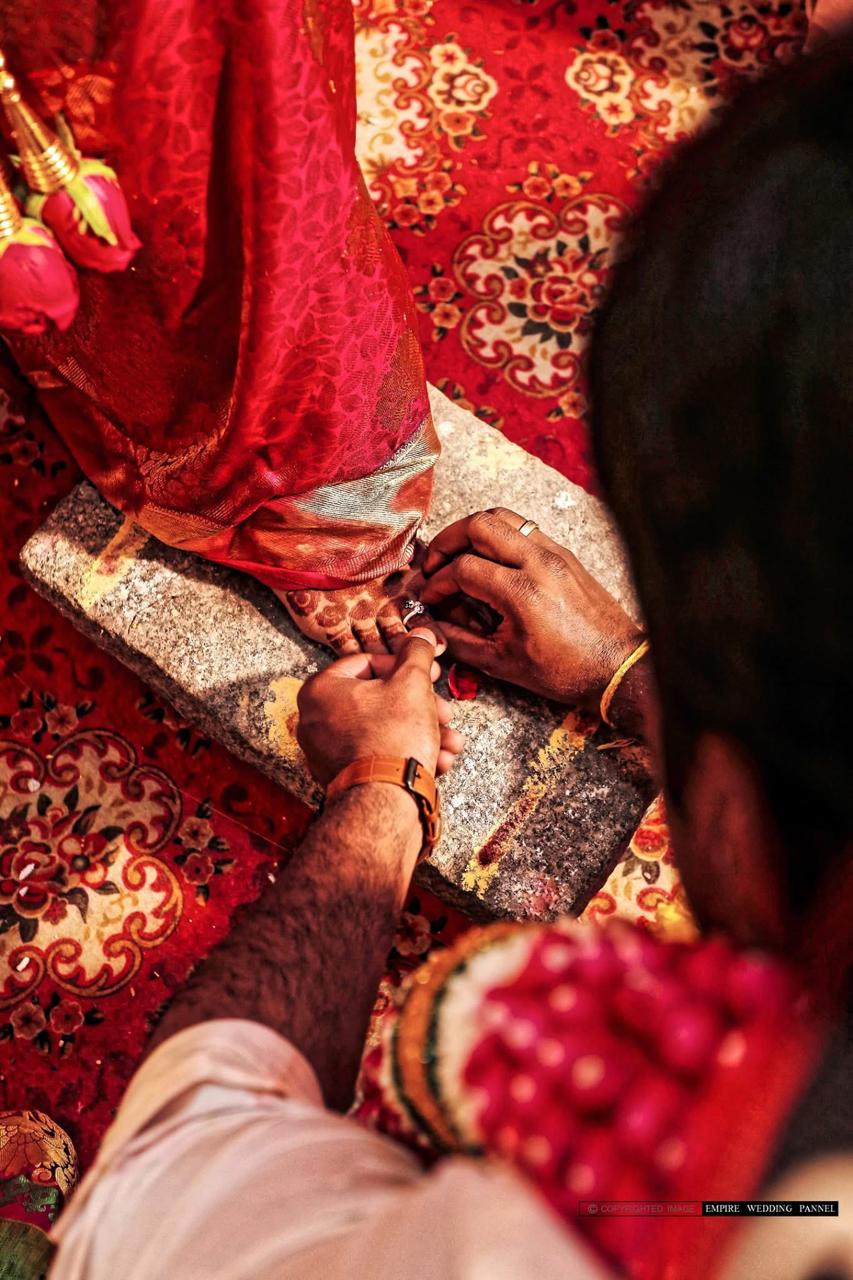 Traditional wedding ring ceremony detail